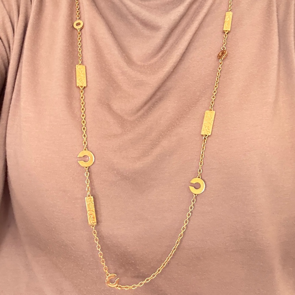 COACH Signature Gold Necklace with pink and clear stones.